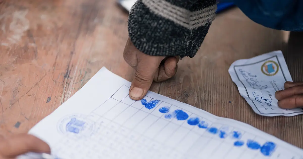 Hand marking a hand-drawn chart in ink, a record only a person could produce