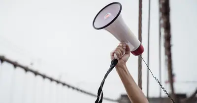 Megaphone representing unlinked brand mentions as implied link signals