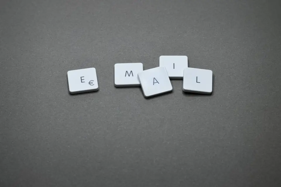 Letter tiles spelling the word 'email' on a grey background