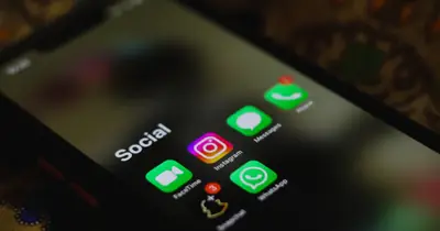 Social media applications on a phone representing social signals and SEO