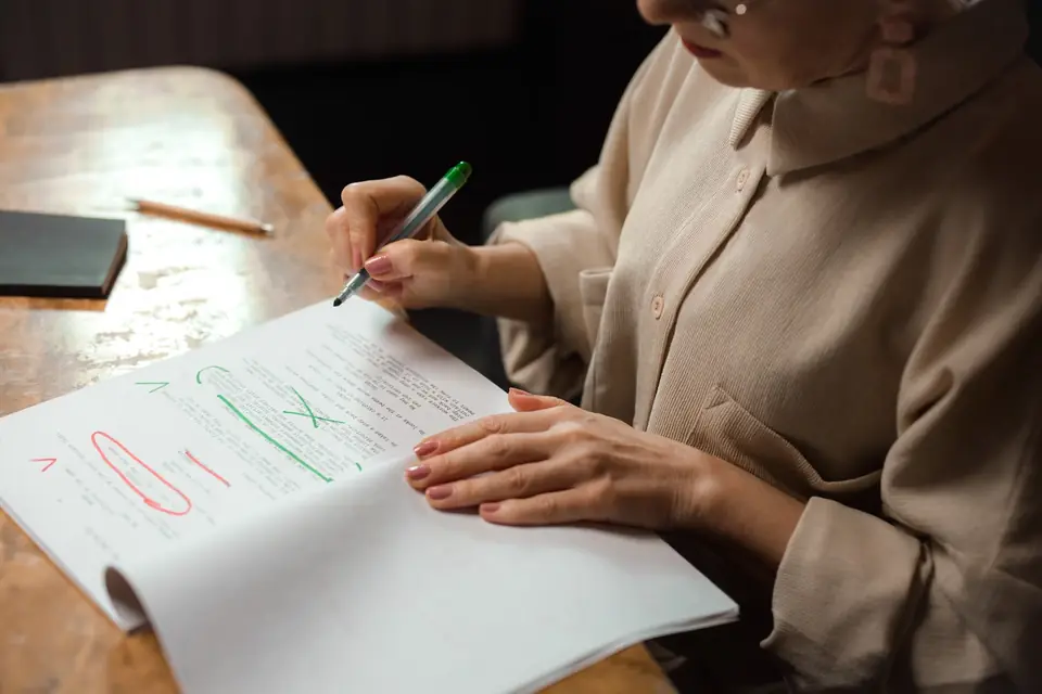 Editor fact-checking and proofreading a draft before publication