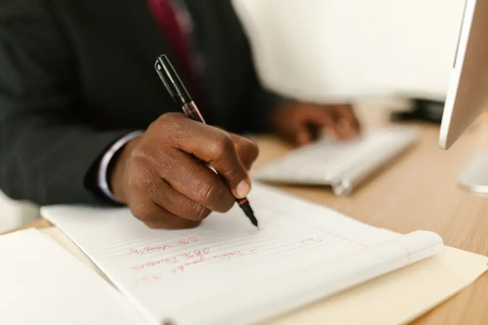 Copywriter drafting meta descriptions designed to raise click-through rate
