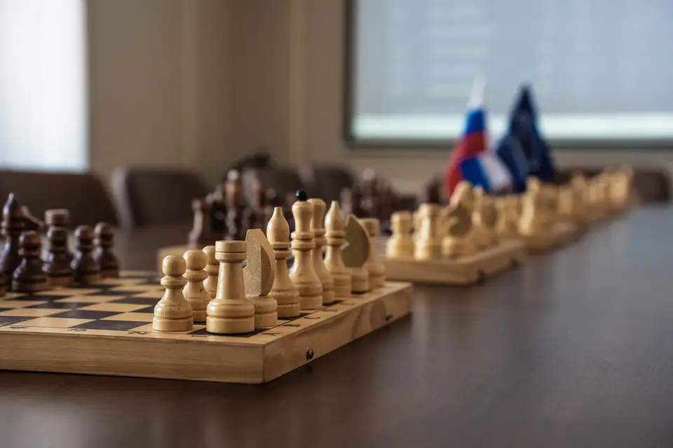 Chess pieces set up for the opening move