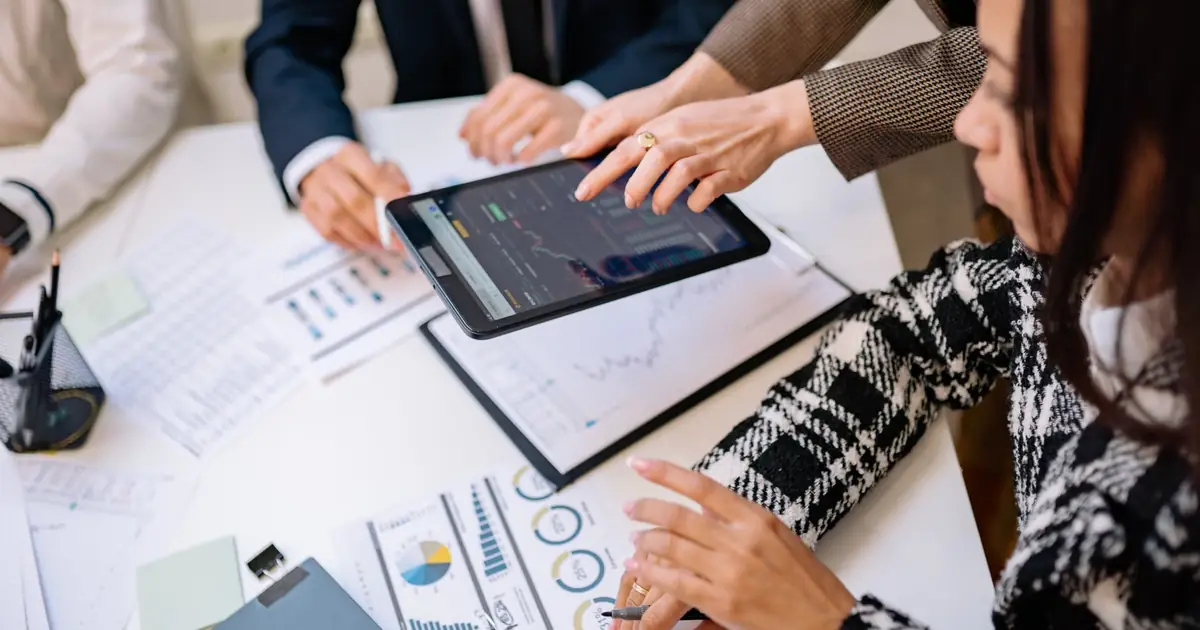 Analytics dashboards reviewed in a strategy meeting for organic growth