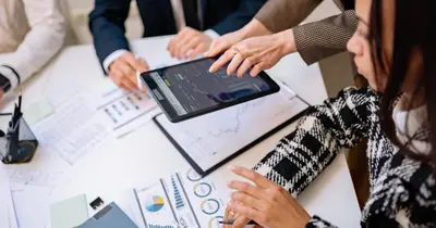 Analytics dashboards reviewed in a strategy meeting for organic growth