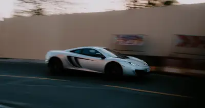 Car at speed, motion-blurred — speed measured as it is actually felt