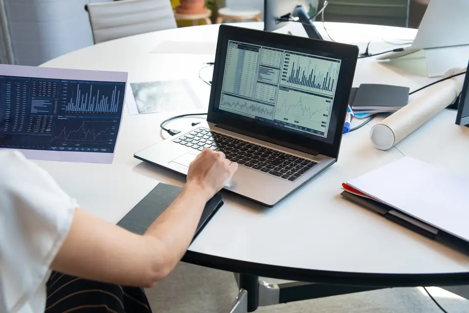 Analyst monitoring Core Web Vitals trend charts for performance regressions