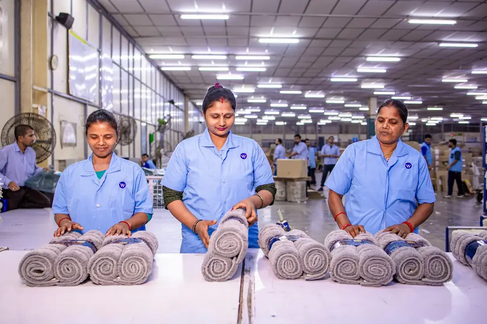 Production line workers performing the same checked step every time