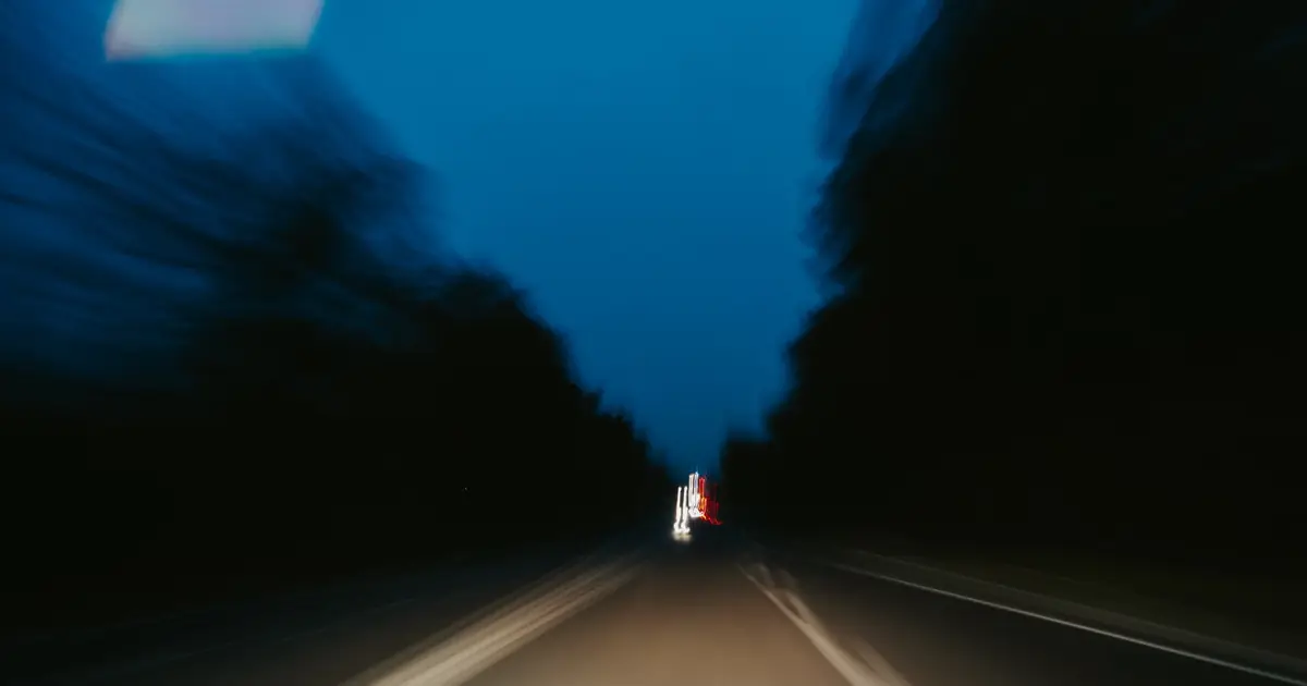 Open road at speed, motion-blurred